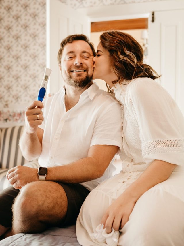 man in white button up shirt sitting beside woman in white shirt