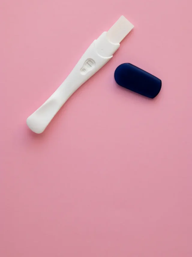 top-view-hand-holding-pregnancy-test